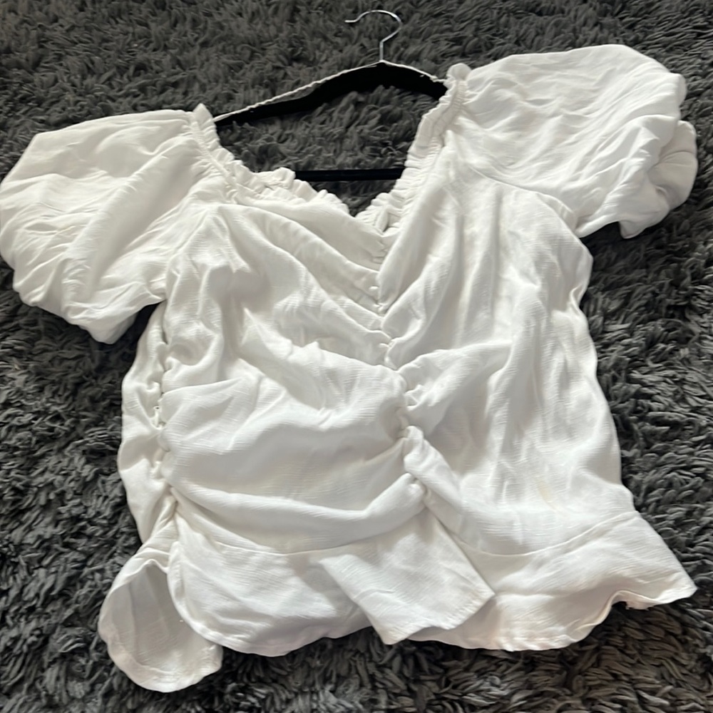 Ruch in the front and back, puff sleeves, comfortable and cute with jeans